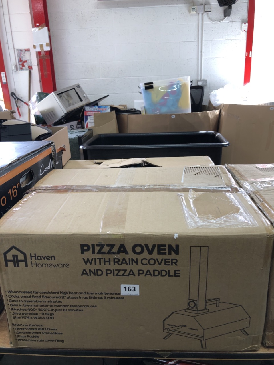 John Pye Auctions - HAVEN HOMEWEAR PIZZA OVEN WITH RAIN COVER AND PIZZA  PADDLE (COLLECTION OR OPTIONAL DELIVERY AVAILABLE*)