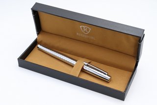 RUCKSTUHL STAINLESS STEEL LUXURY PEN IN GIFT BOX. HAND ASSEMBLED: LOCATION - BOOTH TABLE