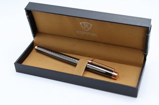 RUCKSTUHL BLACK & ROSE GOLD COLOURED STAINLESS STEEL LUXURY PEN IN GIFT BOX. HAND ASSEMBLED: LOCATION - BOOTH TABLE
