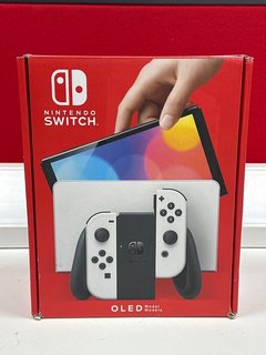 NINTENDO SWITCH OLED 64 GB GAMES CONSOLE (ORIGINAL RRP - £309.99) IN WHITE: MODEL NO HEG-001 (WITH BOX & ALL ACCESSORIES, MINOR COSMETIC IMPERFECTION) [JPTM103101]. THIS PRODUCT IS FULLY FUNCTIONAL A