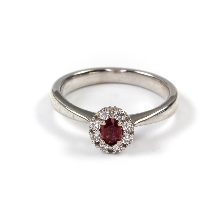 18K White 0.35ct Ruby and 0.12ct Diamond Halo Ring, Size J, 3.4g.  Auction Guide: £500-£600