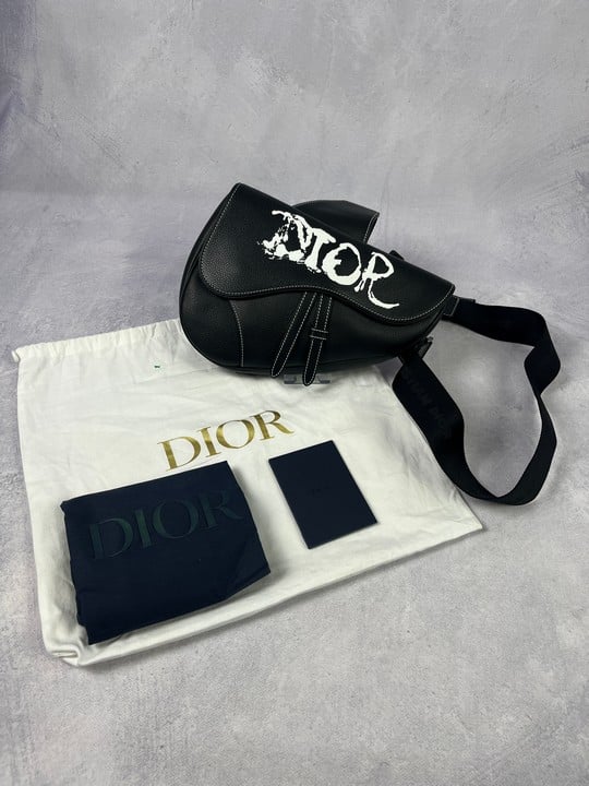Christian Dior Black Saddle Bag, Comes with Dust Bag.   Dimensions:Approx H:20cm W:27cm D:6cm.