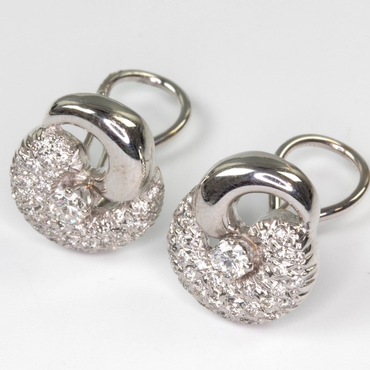 14K White 1.00ct Diamond Single Stone and Cluster Pavé Earrings, 1.7x1.5cm, 8.1g.  Auction Guide: £600-£700