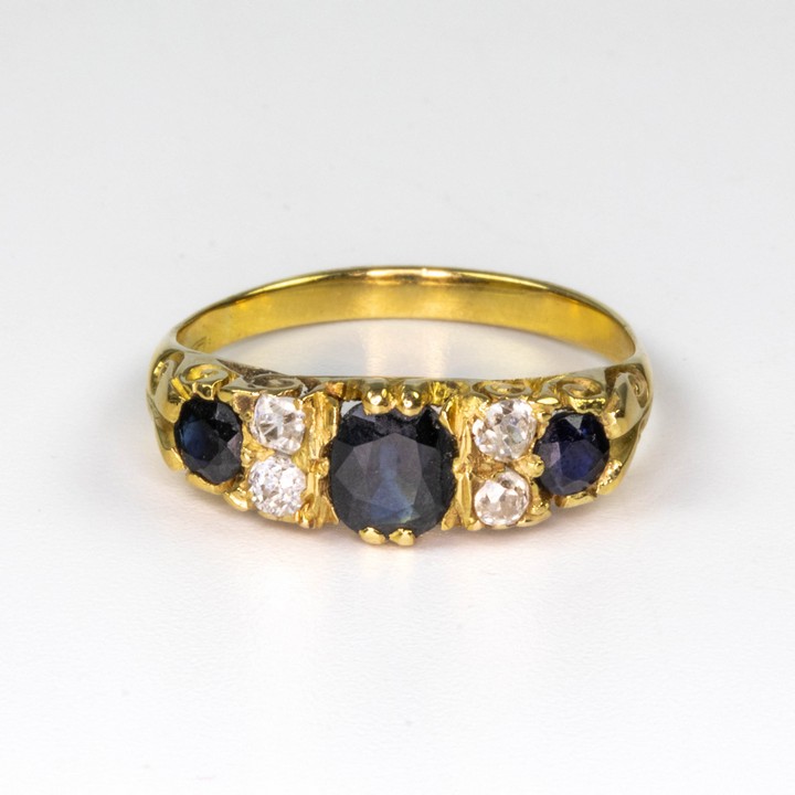 18K Yellow 0.12ct Diamond and Sapphire Three Stone Ring, Size N½, 3.7g.  Auction Guide: £275-£375