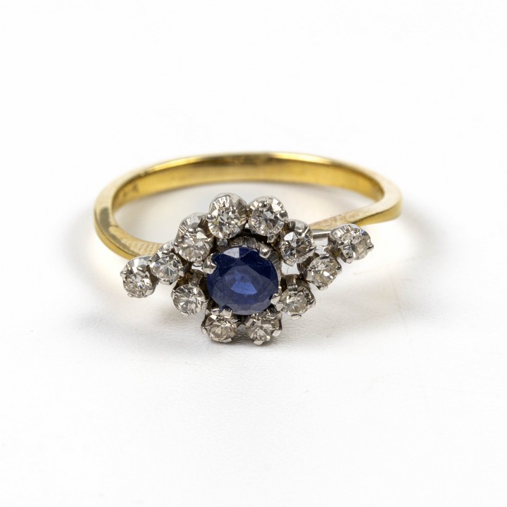 18K Yellow and White 0.56ct Sapphire and 0.40ct Diamond Twist Ring, Size M, 2.9g.  Auction Guide: £400-£500