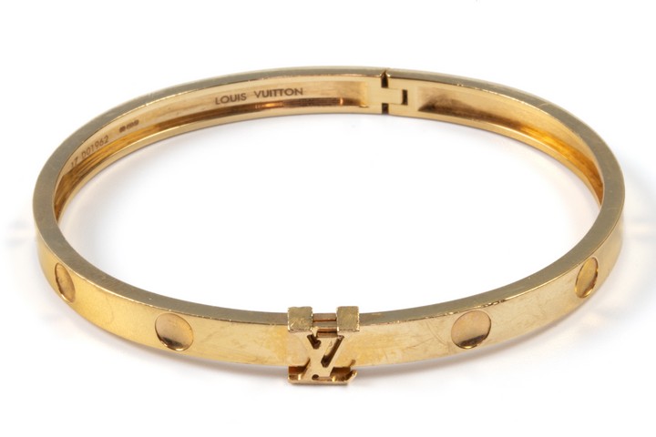 Louis Vuitton 18ct Gold Imprinted Bangle, 23g.  Auction Guide: £700-£900