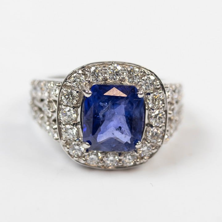 18K White 3.14ct Natural Blue Sapphire and 2.00ct Diamond Halo and Shoulders Ring, Size M½, 7.7g. Colour F-G, Clarity VS1-VS2. Cert WGI9624144308.  Auction Guide: £4,900-£6,000