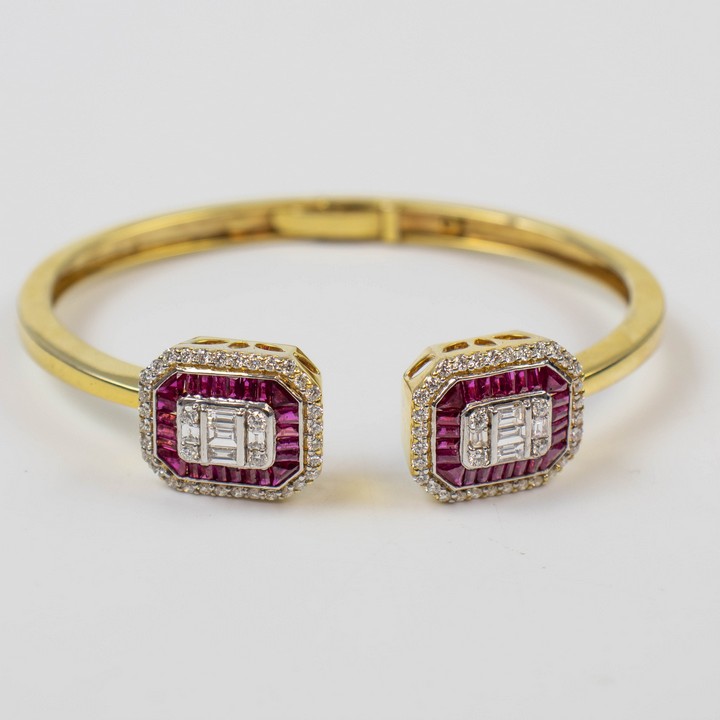 18K Yellow 2.16ct Ruby and 1.60ct Diamond Hinged Bangle, 17cm, 20.6g. Colour H-I, Clarity VS1-VS2. Cert WGI9624143814.  Auction Guide: £4,500-£6,000