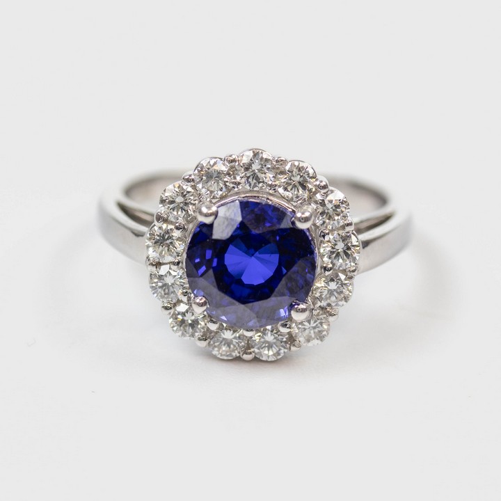 18K White 3.14ct Blue Sapphire and 0.62ct Diamond Halo Ring, Size M, 5.2g. Colour F-G, Clarity VS. Cert IGI24J7357123.  Auction Guide: £2,100-£2,600