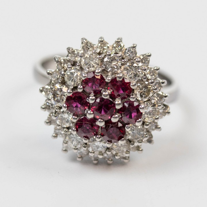 18K White1.00ct Natural Burmese Ruby and 1.00ct Diamond Cluster Ring, Size N, 6.3g.  Auction Guide: £1,700-£2,000