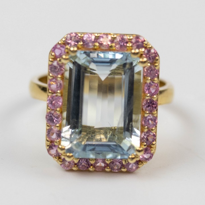 18K Yellow 5.00ct Natural Aquamarine and 1.00ct Pink Sapphire Halo Ring, Size N½, 6.8g.  Auction Guide: £1,100-£1,300