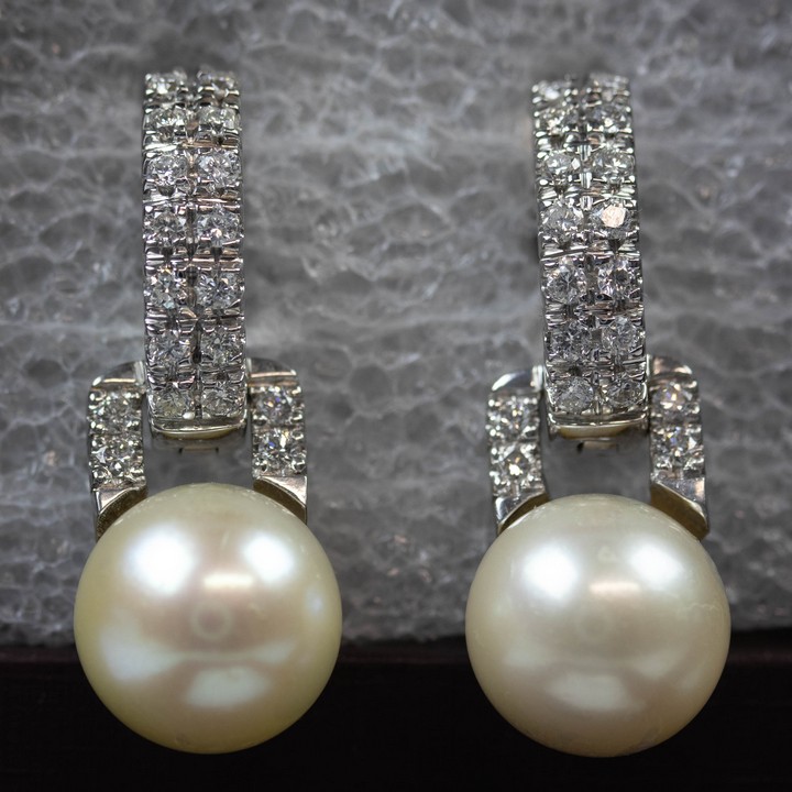 18K White 1.00ct Natural Diamond with South Sea Pearl Earrings, 3cm, 11.6g. Colour F, Clarity VS1.  Auction Guide: £1,900-£2,100