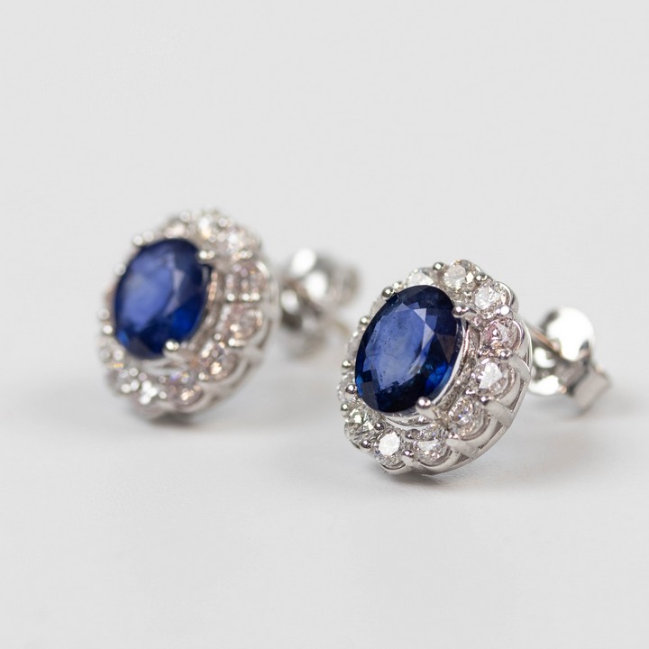 18K White 2.40ct Natural Royal Blue Sapphire and 0.89ct Diamond Stud Earrings, 1.1x1cm, 3.4g. Colour F-G, Clarity VS. Cert IGI24J7356323.  Auction Guide: £1,700-£2,000