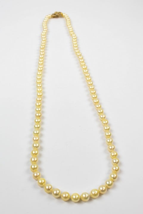 18K Yellow 0.80ct Diamond Clasp and Akoya Cultured Pearls Necklace, 89cm, 90.8g. Colour F-G, Clarity VS. Cert WGI9624137081.  Auction Guide: £2,700-£3,200