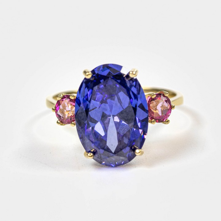 9ct Yellow Gold Oval Faceted Tanzanite with Round Pink Topaz Ring, Size O, 3.9g.  Auction Guide: £125-£225