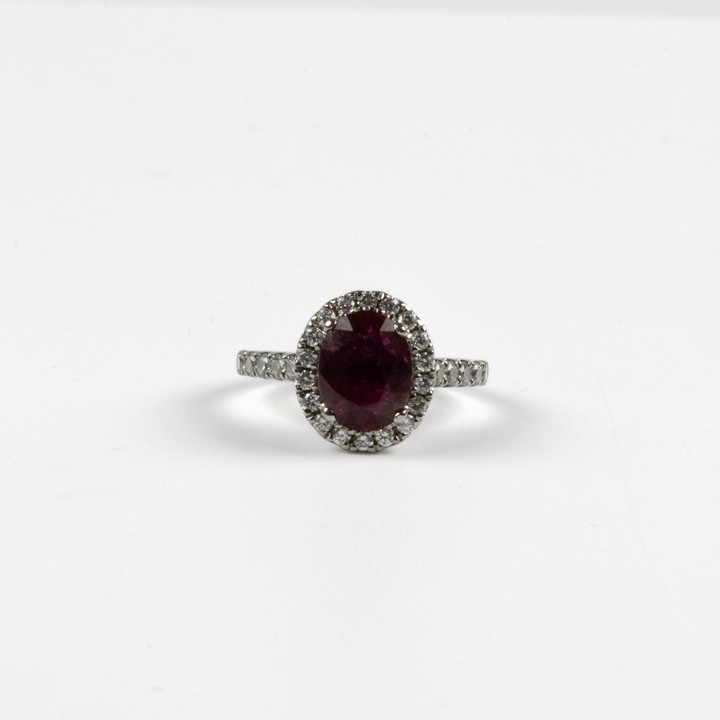 18ct White Gold 1.76ct Ruby and 0.58ct Diamond Halo and Shoulders Ring, Size J, 3.4g. Colour G-H, Clarity Si1-Si2. Report WGI9624146883.  Auction Guide: £3,000-£3,500 (VAT Only Payable on Buyers Prem