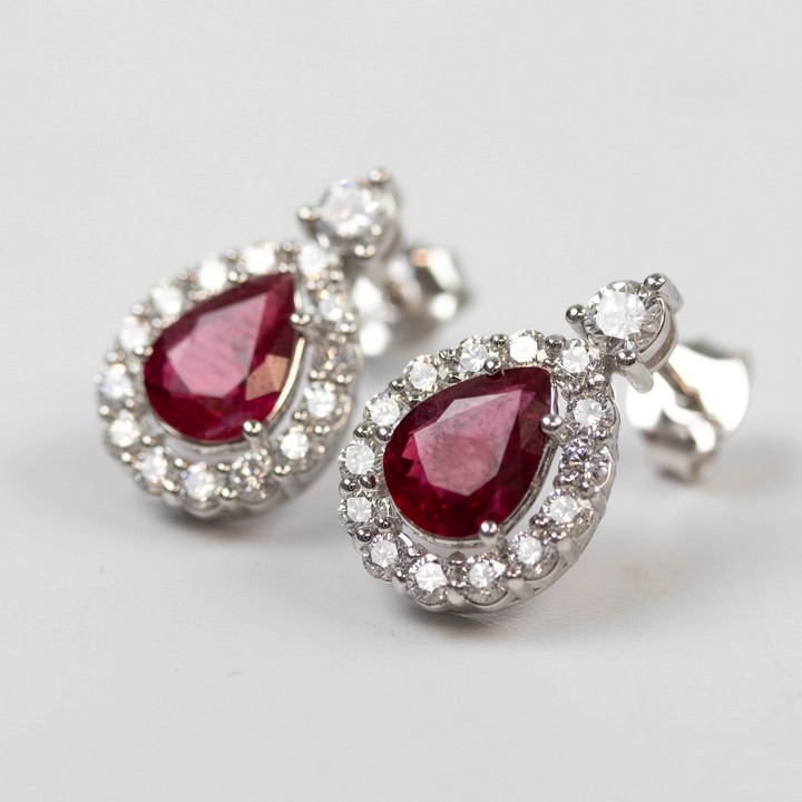 18K White 2.03ct Natural Burmese Pigeon Blood Ruby and 0.94ct Diamond Halo Drop Earrings, 1.6x1cm, 3.8g. Colour F-G, Clarity VS. Report IGI24J7356223.  Auction Guide: £1,650-£2,150 (VAT Only Payable