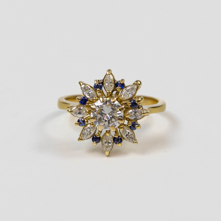 18ct Yellow Gold 2.35ct Diamond and 0.08ct Sapphire Flower Ring, Size M, 4.5g.  Auction Guide: £1,400-£1,900 (VAT Only Payable on Buyers Premium)