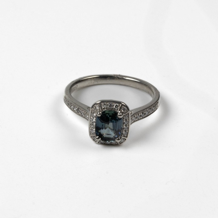 Platinum 950 1.02ct Teal Sapphire and 0.18ct Diamond Halo and Shoulders Ring, Size M, 4.8g.  Auction Guide: £800-£1,000