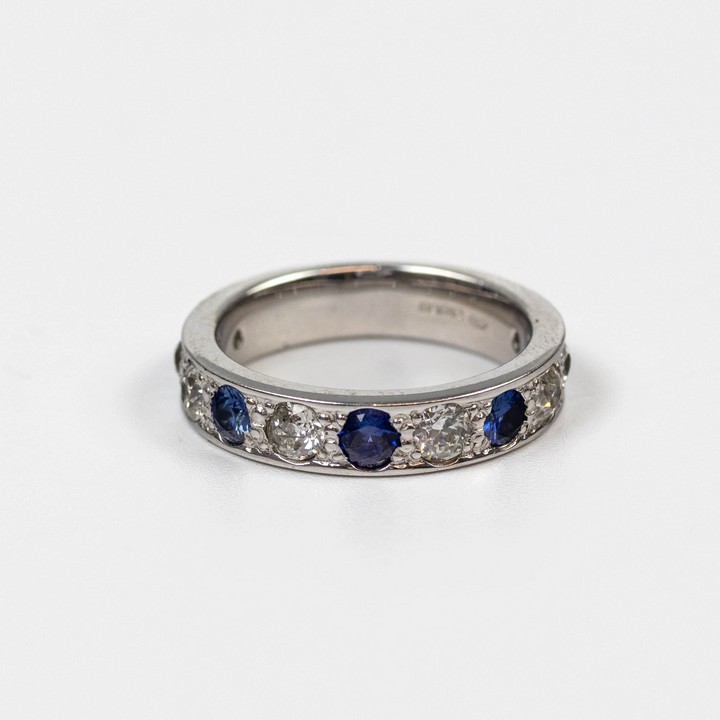 18ct White Gold 1.10ct Diamond and 0.30ct Sapphire Eternity Ring, Size N, 7.8g.  Auction Guide: £750-£950 (VAT Only Payable on Buyers Premium)