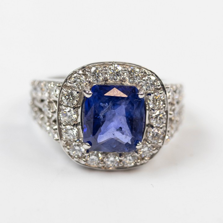 18K White 3.14ct Natural Blue Sapphire and 2.00ct Diamond Halo and Shoulders Ring, Size M½, 7.7g. Colour F-G, Clarity VS1-VS2. Report WGI9624144308.  Auction Guide: £3,450-£3,950 (VAT Only Payable on