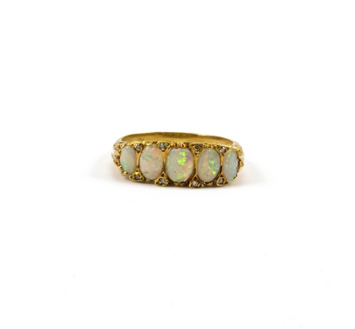 18ct Yellow Gold Opal and Diamond Band Ring, Size O½, 5.2g.  Auction Guide: £450-£550 (VAT Only Payable on Buyers Premium)