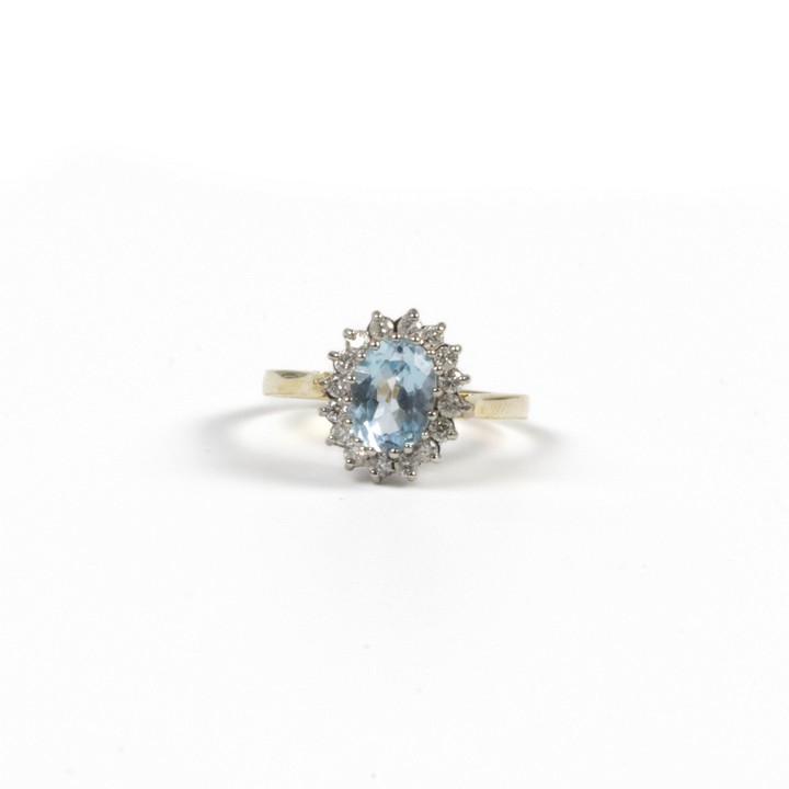 9ct Yellow and White Gold Blue Topaz and Diamond Halo Ring, Size O½, 2.6g.  Auction Guide: £300-£400