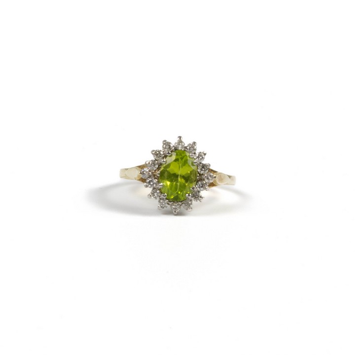 9ct Yellow and White Gold Peridot with Diamond Halo Ring, Size N½, 2g.  Auction Guide: £300-£400