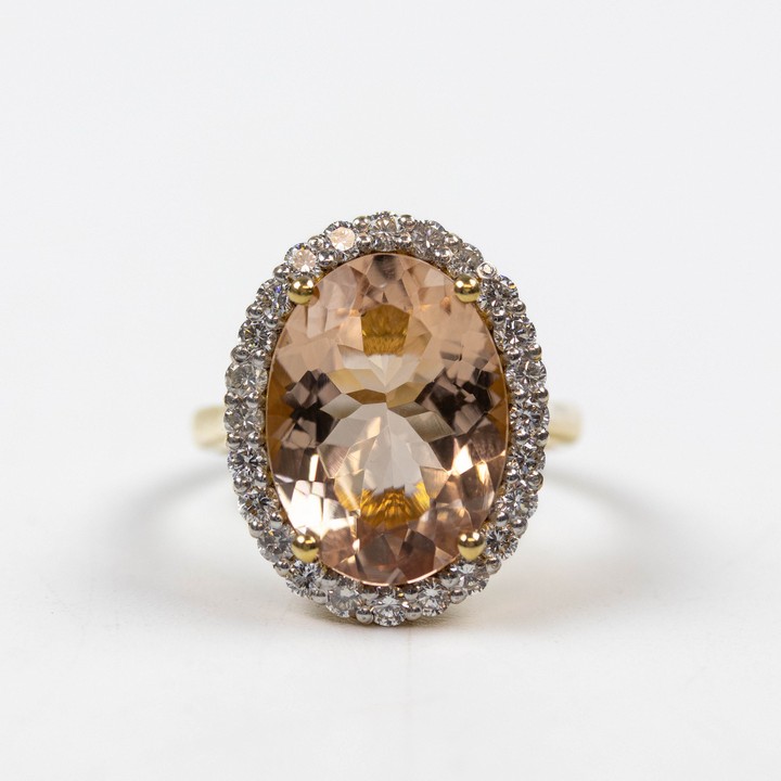 18K Yellow 7.00ct Natural Morganite and 1.00ct Natural Diamond Halo Ring, Size L½, 6.3g. Colour F-G, Clarity VVS.  Auction Guide: £2,000-£2,500 (VAT Only Payable on Buyers Premium)