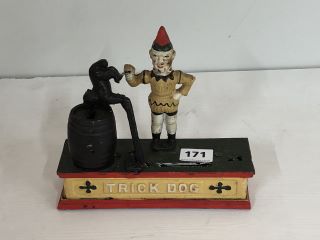 A VICTORIAN CAST IRON MECHANICAL NOVELTY MONEY BOX, "TRICK DOG"