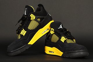 NIKE AIR JORDAN 4 RETRO TRAINERS IN BLACK/WHITE/TOUR YELLOW - SIZE UK8.5 - RRP £210: LOCATION - BOOTH