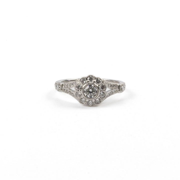 Platinum 950 0.72ct Diamond Flower and Shoulders Ring, Size L½, 4.4g. Colour H, Clarity Si2.  Auction Guide: £950-£1,150