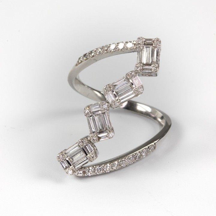 18K White 0.59ct Diamond Baguette and Round-cut Twisted Dress Ring, Size M, 3.8g.  Auction Guide: £900-£1,100