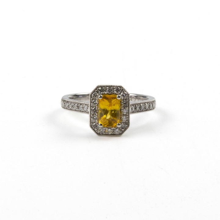 Platinum 950 1.09ct Yellow Sapphire and 0.35ct Diamond Halo and Shoulders Ring, Size M, 4.9g.  Auction Guide: £900-£1,100