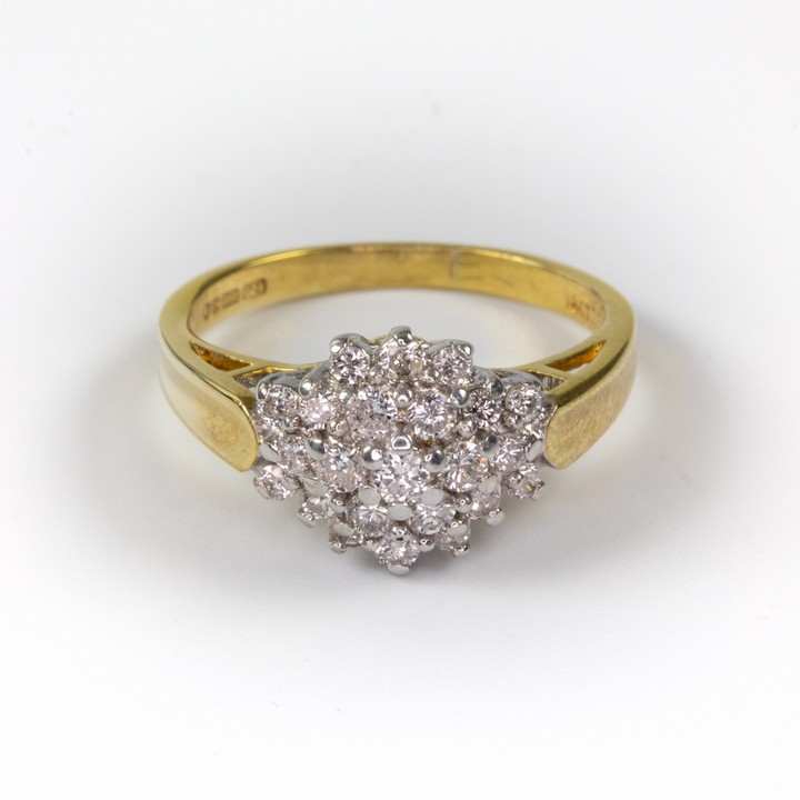 18ct Yellow and White Gold 0.60ct Diamond Cluster Ring, Size K½, 4.1g. Colour G-H, Clarity Si.  Auction Guide: £750-£950 (VAT Only Payable on Buyers Premium)