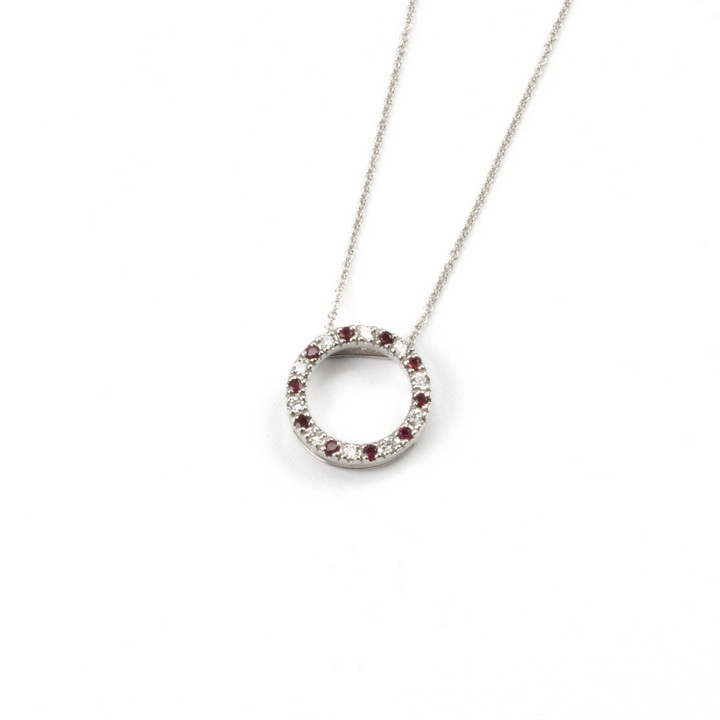 18ct White Gold 0.21ct Ruby and 0.16ct Diamond Circular Pendant and Chain, 45cm, 3.1g.  Auction Guide: £600-£800