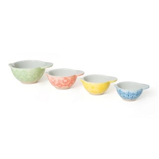 QTY OF NADIYA MEASURING CUPS EMBOSSED IN GREEN, RED, YELLOW AND BLUE (4 X 16): LOCATION - E2