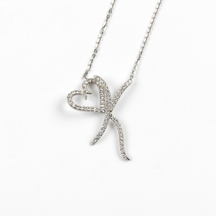 18K White 0.60ct Diamond Initial K Heart Pendant, 3x2.4cm, and Chain, 45cm, 3.6g.  Auction Guide: £900-£1,100
