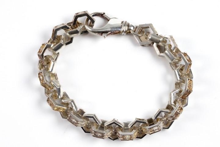 Silver Patterned Hexagonal Link with Orange Tint Bracelet, 21cm, 30.6g. (VAT Only Payable on Buyers Premium)