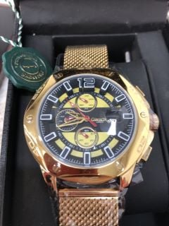 GAMAGES LONDON WATCH WITH YELLOW/BLACK FACE, WHITE DIAL, GOLD BEZEL AND STAINLESS STEEL GOLD STRAP