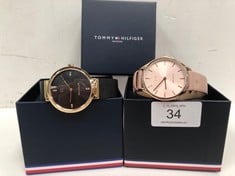 2 X TOMMY HILFIGER WATCHES MODELS TH.391.3.34.2815S TH.395.3.34.2851 (THE BLACK ONE HAS A BROKEN CLASP).