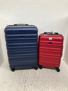 JOHN LEWIS & PARTNERS MEDIUM HARD SHELL SWIVEL SUITCASE IN NAVY TO INCLUDE CABIN CASE IN RED: LOCATION - A17