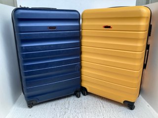JOHN LEWIS & PARTNERS LARGE HARD SHELL SWIVEL SUITCASE IN YELLOW TO INCLUDE LARGE HARD SHELL SWIVEL SUITCASE IN NAVY: LOCATION - A17