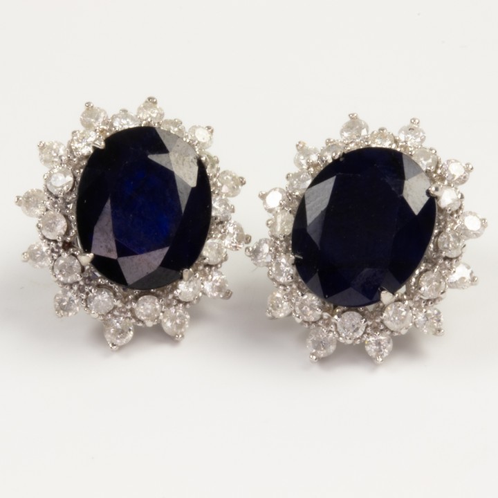 6.22ct Blue Sapphire and 1.25ct Diamond Halo Stud Earrings, 6g.  Auction Guide: £10,000-£12,000 (VAT Only Payable on Buyers Premium)