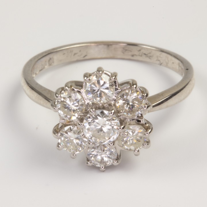 18ct White Gold 1.25ct Diamond Flower Ring, Size M½, 3.7g. Colour F-G, Clarity VS-Si.  Auction Guide: £1,300-£1,800 (VAT Only Payable on Buyers Premium)