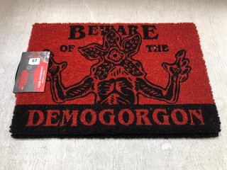 2 X STRANGER THINGS PRINTED COIR DOOR MATS IN RED AND BLACK: LOCATION - H1 FRONT