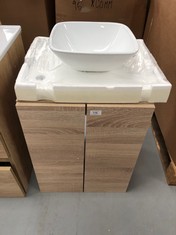 OAK COLOURED BATHROOM VANITY UNIT WITH WASHBASIN AND TWO-DOOR CABINET MAY BE DAMAGED AND INCOMPLETE.