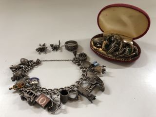 1 X TRUE VINTAGE CHARMS BRACELET WITH STERLING SILVER CHARMS 1 X STERLING SILVER DRAGON RING 1 X SET OF ED HARDY EARRINGS AND A QTY OF VINTAGE COSTUME RINGS