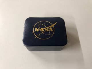 A BOXED PAIR OF NASA CUFFLINKS