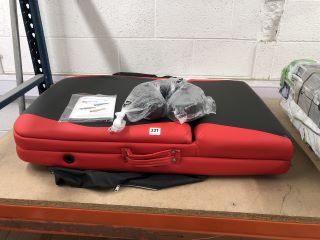 A PORTABLE MASSAGE TABLE IN RED AND BLACK